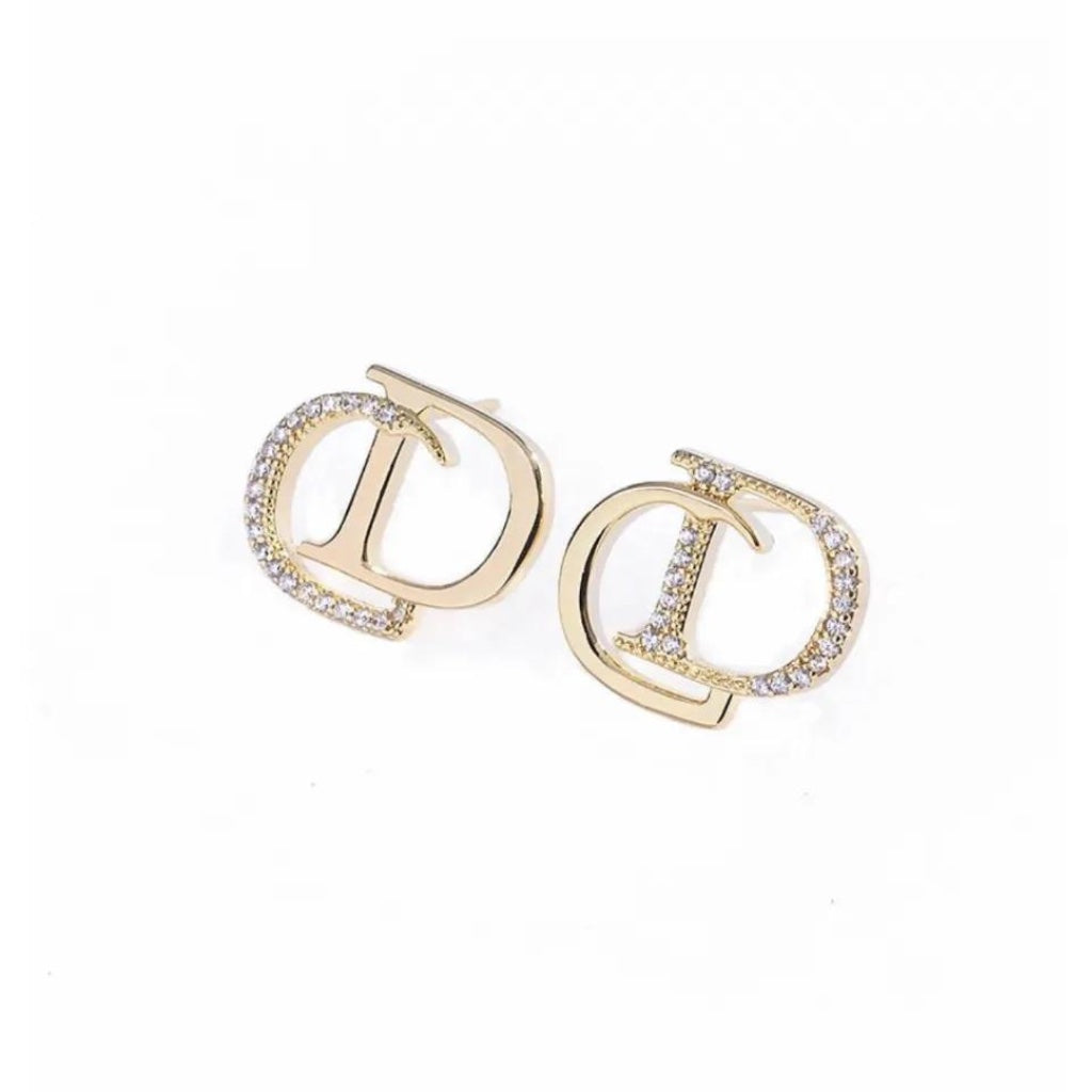 cone charm huggie earrings in gold with cubic zirconias