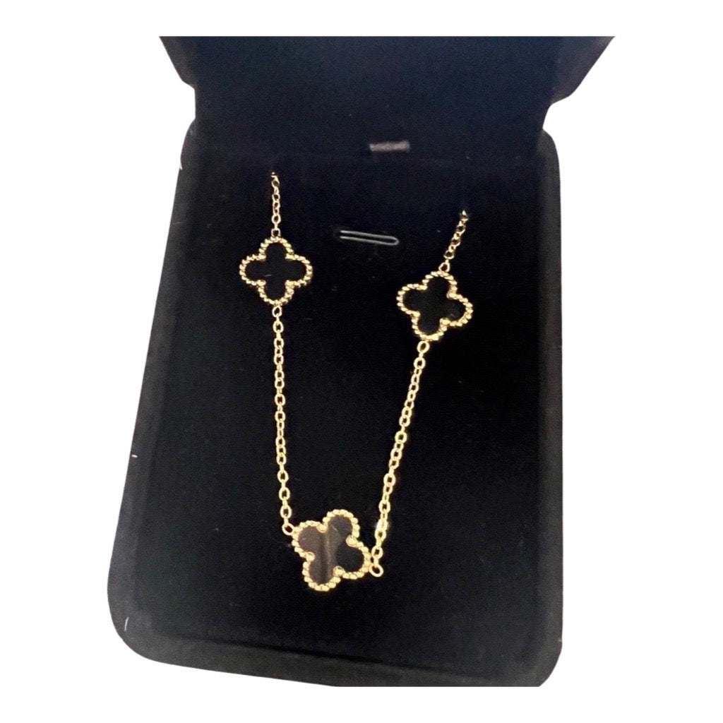 mutli clover necklace in black box 